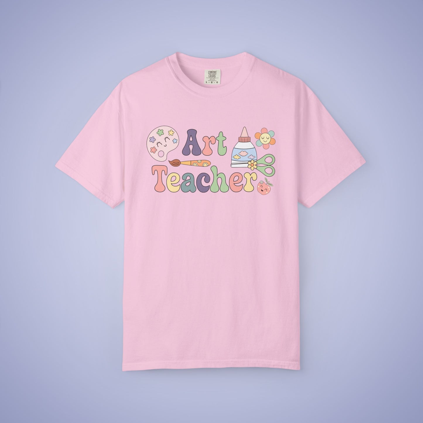 Pink t shirt with 'Art Teacher' text and graphics on a light pink background