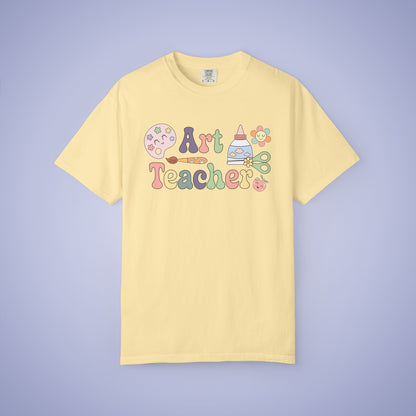 Yellow t shirt with 'Art Teacher' text and graphics on a yellow background